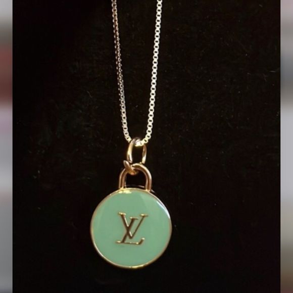 Louis Vuitton Jewelry - Authentic LV bag charm with 18 “ sterling silver chain